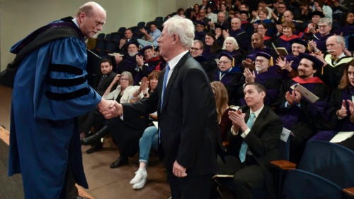 Dean Treanor shakes hands with Scott Ginsburg