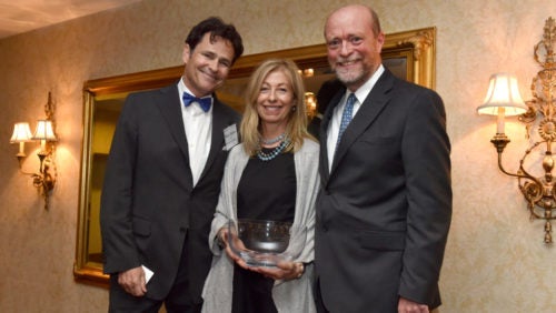 Bruce (L’80) and Ann Blume (Parents ’08, ’20), shown here with Georgetown Law Dean William M. Treanor,