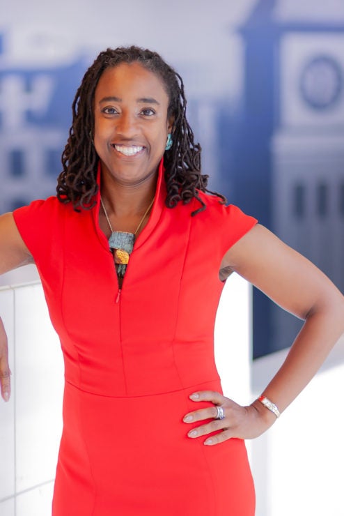 Professor Kris Henning with Georgetown Campus in background