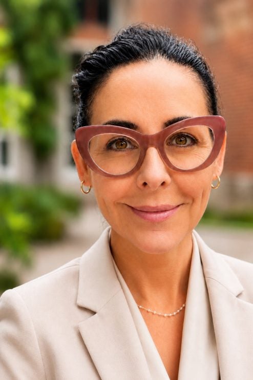 Kristelia Garcia headshot in a beige blazer.