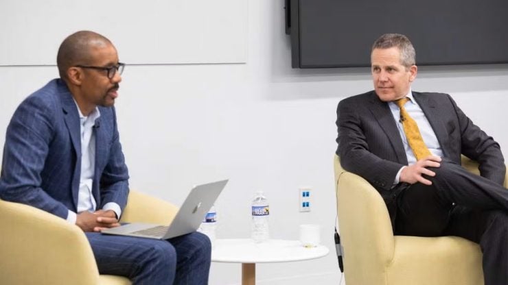 Chris Brummer on stage interviewing Federal Reserve Vice Chair Michael Barr