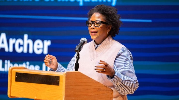 Deborah N. Archer presenting at a podium