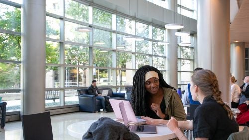 students studying in the lobby of the fitness center