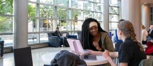 students studying in the lobby of the fitness center