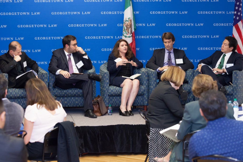 Professor Carnes, Dany Bahar, Celeste Drake, Edward Alden, and Mario Delgado on stage