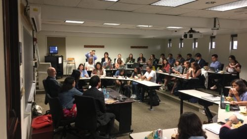 Discussants and students in the background