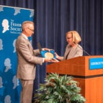 randy barnett hands award to judge larsen