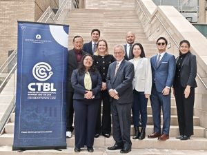 Group photo of the 2025–2026 CTBL Fellows and director Professor Don De Amicis on the steps of Georgetown Law, beside the CTBL banner.