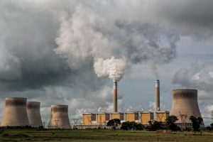 Coal stacks emitting pollutants into the atmosphere