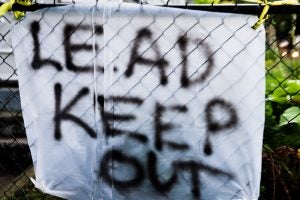 Hand-made sign stating "Lead Keep Out." Photo by Steven Depolo, licensed under https://creativecommons.org/licenses/by/2.0/