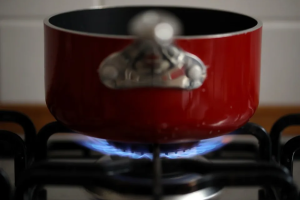 A pot heats up over a gas range. New England consumers of natural gas may face high prices this winter.  