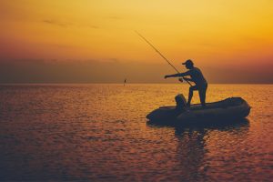 Man fishing at dawn