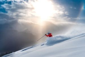 A skiier hitting the slopes in the American Rockies after a large snowfall.