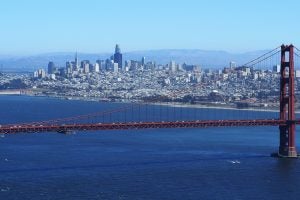 The Golden Gate Bridge with a view of San Francisco in the background.