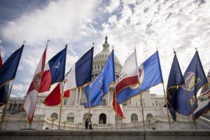 State flags fly outside the United States Capitol in 2021. 