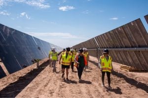 Bureau of Land Management staff walk around a solar construction site in Arizona in 2023.