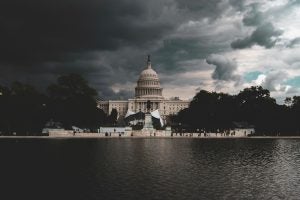 Storm clouds gather over the United States Capitol.
