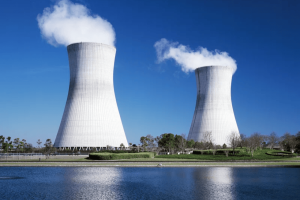 A photo of a water source with two large nuclear cooling towers in the background. See below for image link.