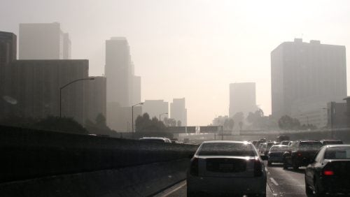 Traffic and smog on a freeway.