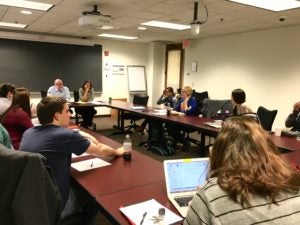 A law classroom with clinic student, clinic faculty director and fellow supervisor.