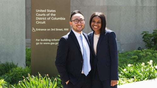 Clinic Students posing outside of the E. Barrett Prettyman Courthouse