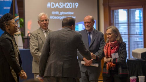 Professors Andrew Schoenholtz, Carlos Vazquez, Maryellen Fullerton, and Dean William Treanor at the 2019 Dash Conference