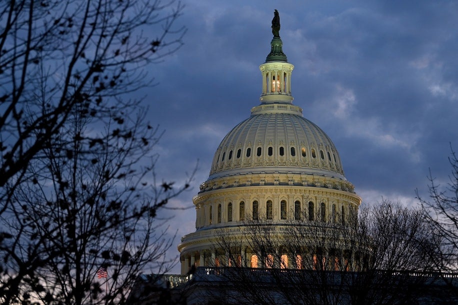 The U.S. Capitol is seen as the sun sets in D.C. in December 2020. (Credit: Katherine Frey/The Washington Post)