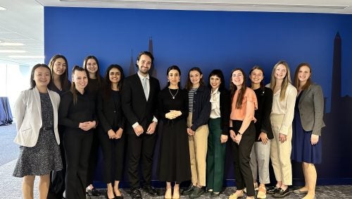 Practicum students pose with Nadia Murad