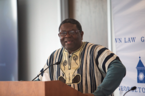Alfred Brownell standing behind a podium, speaking to audience (not pictured)