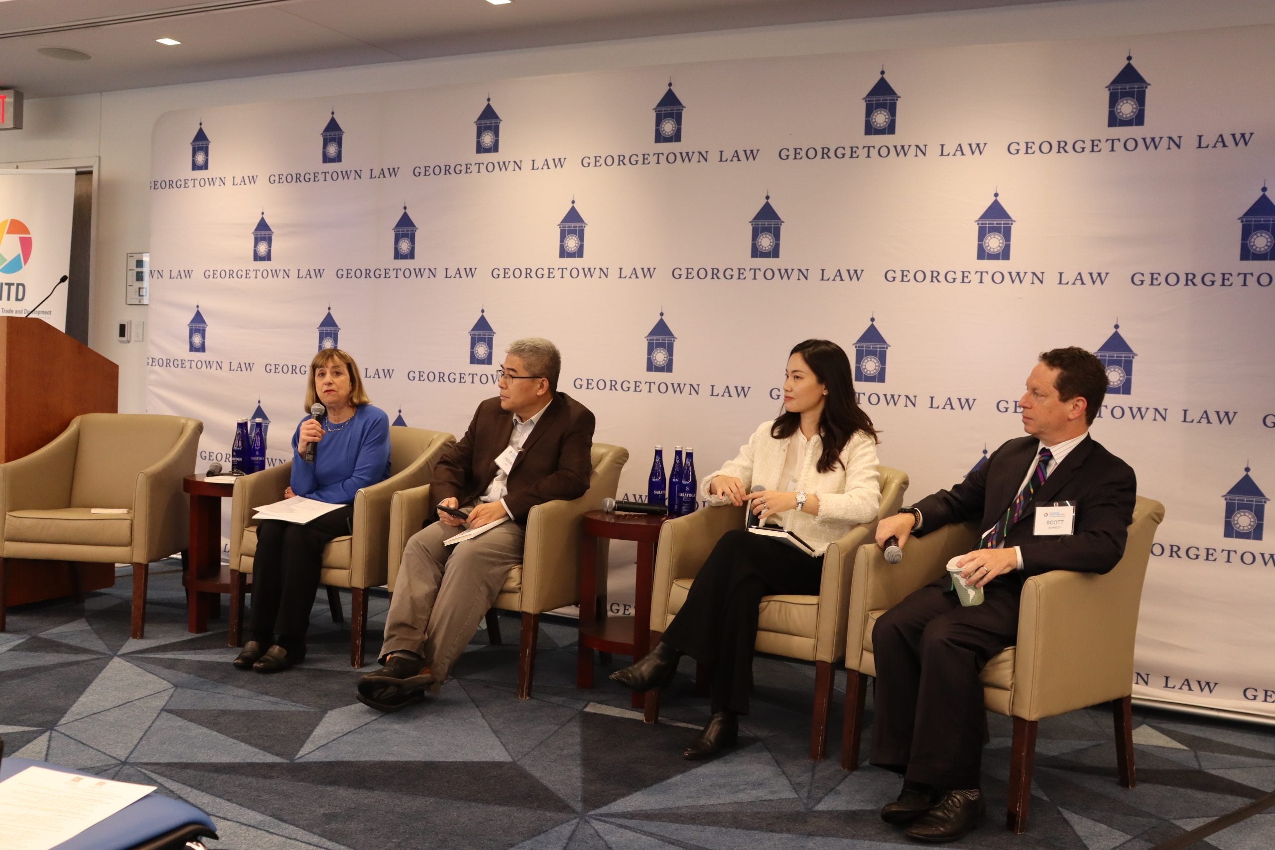 From left to right, Wendy Cutler, Henry Gao, Huan Zhu, and Scott Kennedy speaking to event attendees at China Shock Panel