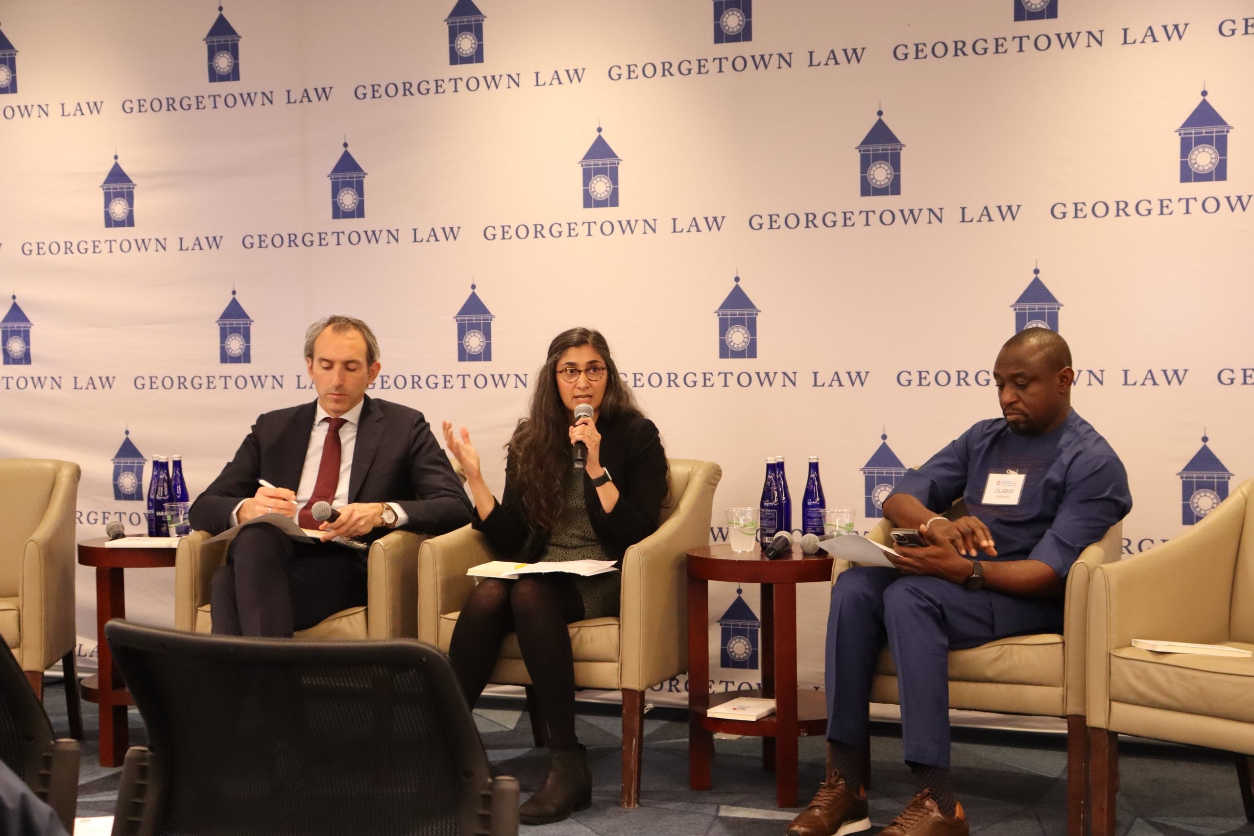 From left to right, Rem Korteweg, Inu Manak, and Olabisi Akinkugbe sitting in chairs presenting to attendees at the Rise of Subsidies Panel