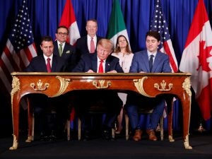President Donald Trump, then-President Enrique Pena Nieto, and then-Prime Minister Justin Trudeau at the USMCA signing ceremony Nov. 30, 2018,(Shealah Craighead, www.flickr.com/photos/whitehouse45/45393231974/in/photostream/, Public Domain)