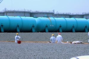 Water is stored in two types of above-ground tanks, as seen here. Workers are working on a below-ground storage pool.