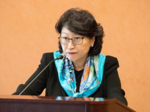 Teresa Cheng at a podium