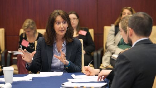 President Mary DeRosa chairs a National Security Council meeting in the situation room