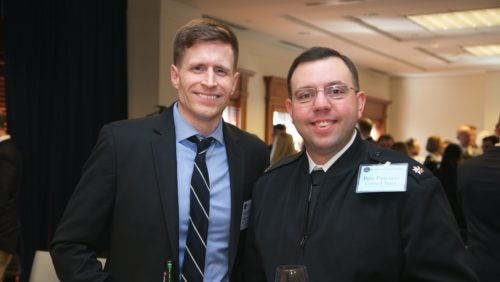 A member of the Control Team and the sim's Attorney General meet face to face after the sim, at the closing reception