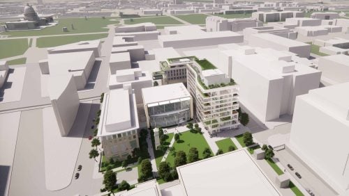 Close aerial view of the southern half of Capitol Campus with local landmarks seen in the distance