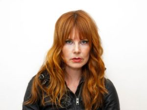 Headshot of Sam Hinds