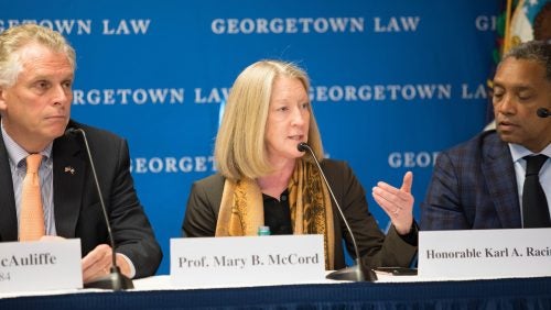 Georgetown Law Professor Mary B. McCord speaking as a panelist at the SALPAL Launch Event Hate Crimes and Online Extremist Recruitment. To the left sits Former Virginia Governor Terry McAuliffe. To the right sits D.C. Attorney General Karl Racine.