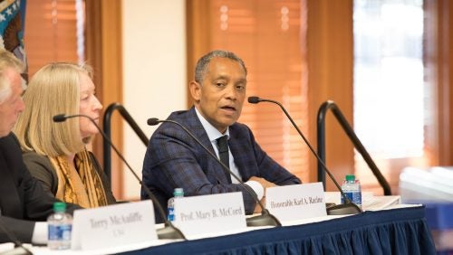 DC Attorney General Karl Racine speaks on the SALPAL Launch Event Panel. To the left sit Former Virginia Governor Terry McAuliffe and Georgetown Law Professor Mary B. McCord