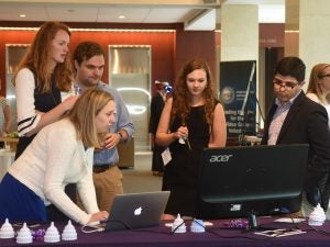 Students explore VR technology in Hotung lobby at Georgetown Law.