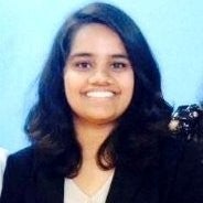 Headshot of Priyadharshini Alagarraj, a smiling woman in a blazer.