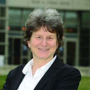 Headshot of Tanina Rostain, a woman with short hair wearing a black suit.