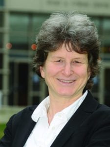 A smiling woman with short hair