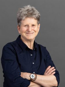 A smiling woman with short hair