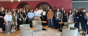 Tech Law Scholars and interested students smile for a picture at the Microsoft DC Office.