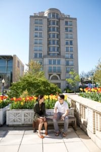 Two students sitting in front of the Gewirz Student Center