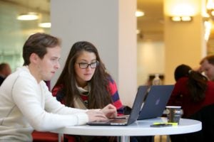 Students looking at laptops