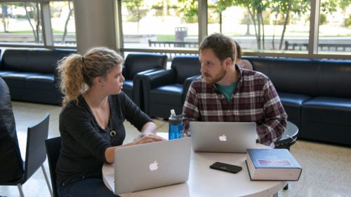 Students seated in Sport & Fitness lobby