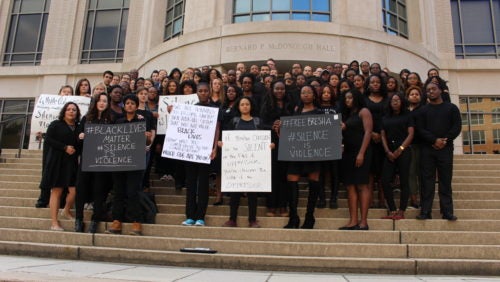 Large group of students standing on the McDonough Hall front steps
